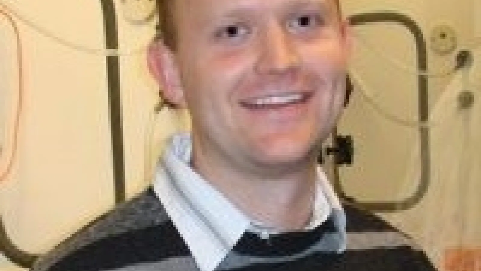 Head shot of Adam Whalley