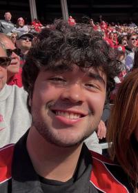 Safety Student Assistant smiling during football game