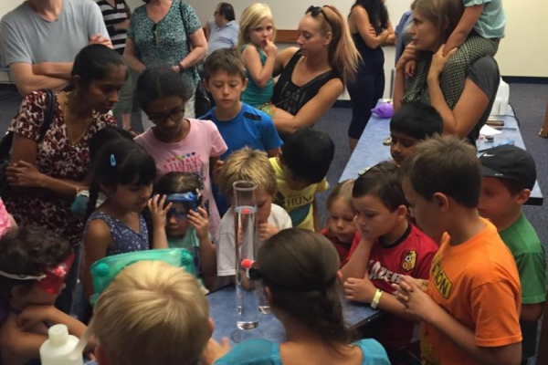 Children watching science demo